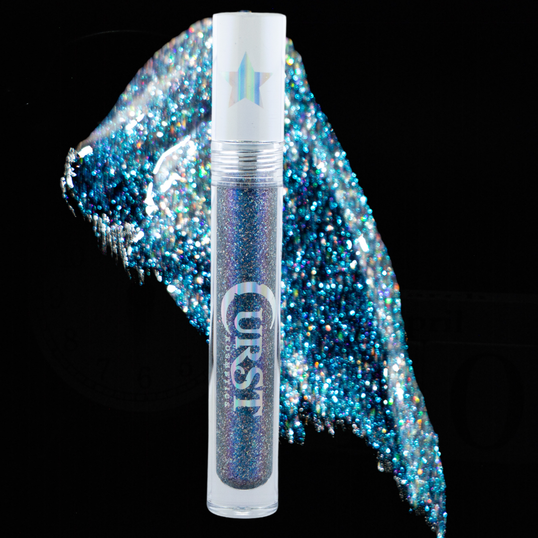 Glittery lip gloss with 'UKST' branding on a black background