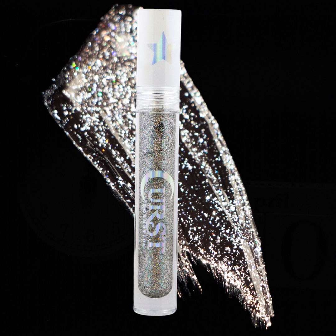 Silver glittery liquid with a clear container labeled 'Crescent' on a black background