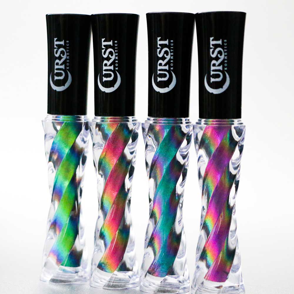 Four bottles of Curse Cosmetics eyeshadows with colorful swirl designs on a white background.
