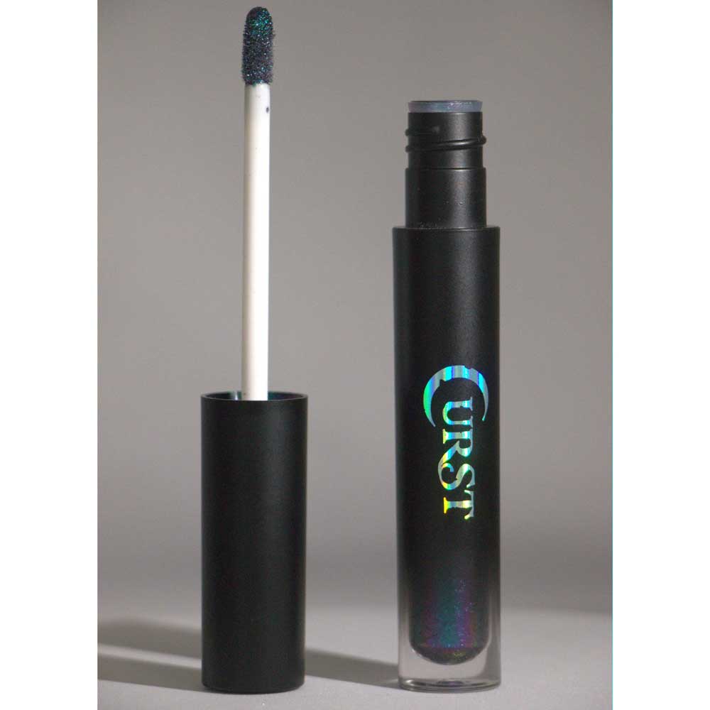 Black mascara with 'CURST' branding on a gray background