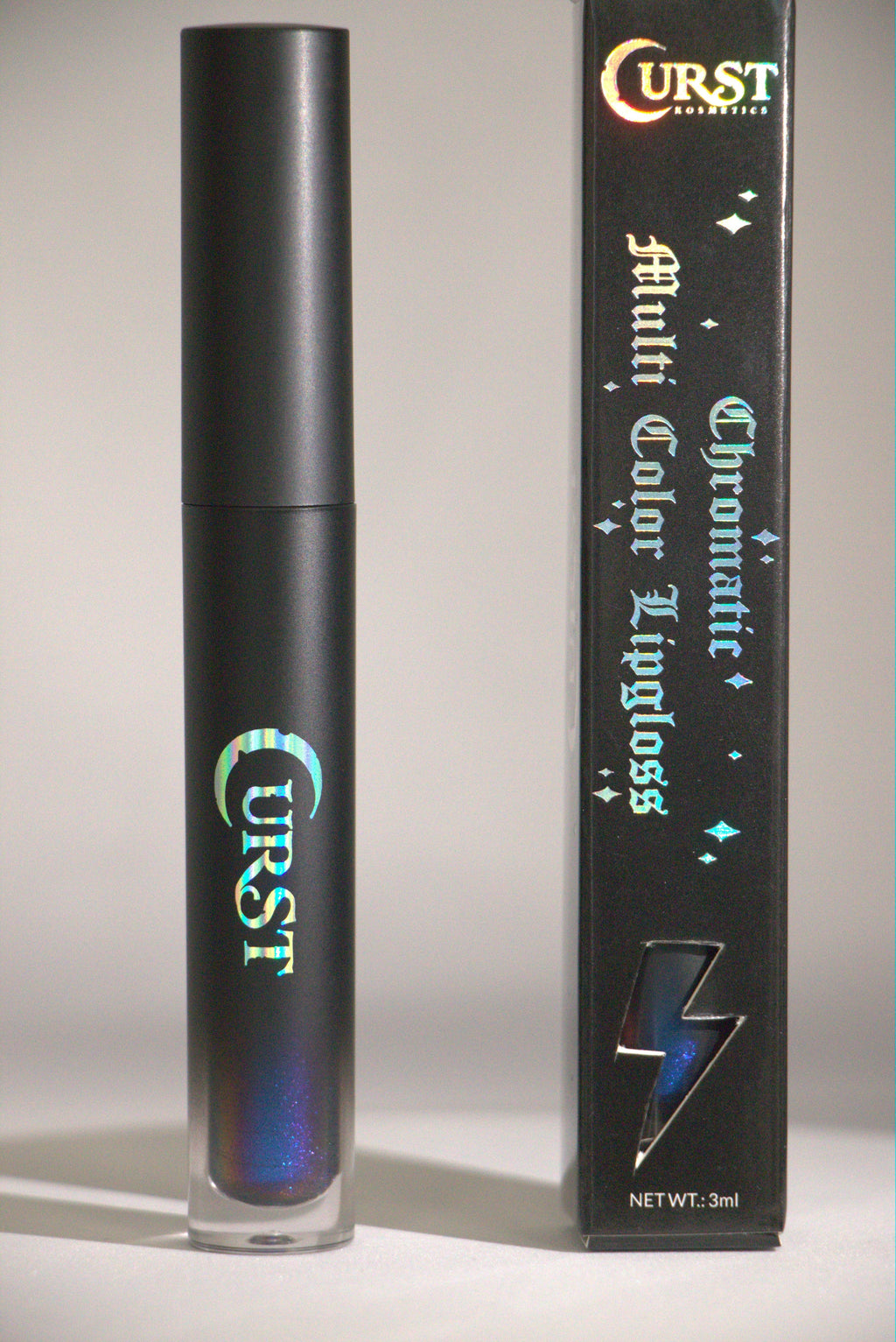 Black lip gloss with 'Curst' branding and packaging on a gray background