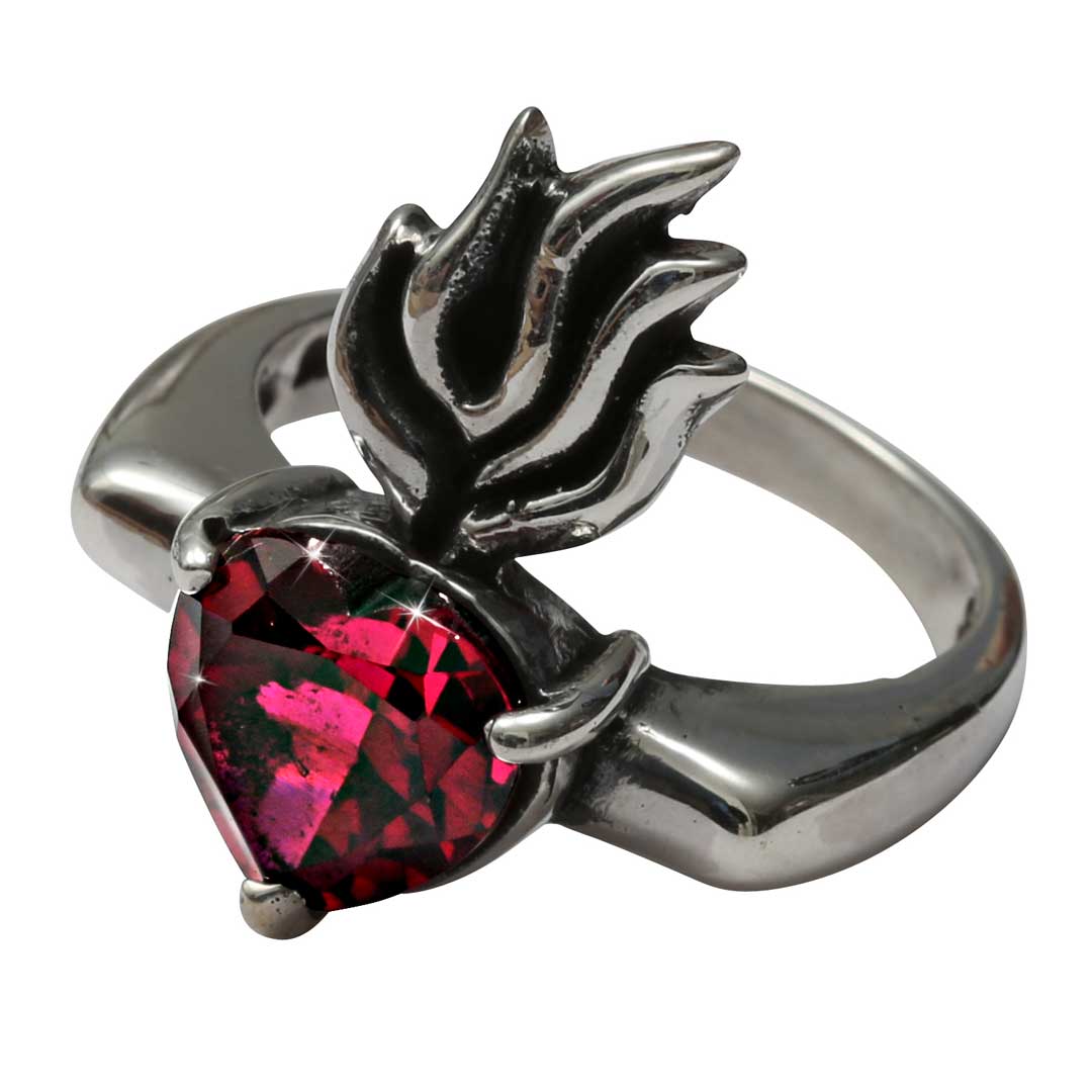 Silver ring with a red heart-shaped gemstone on a white background