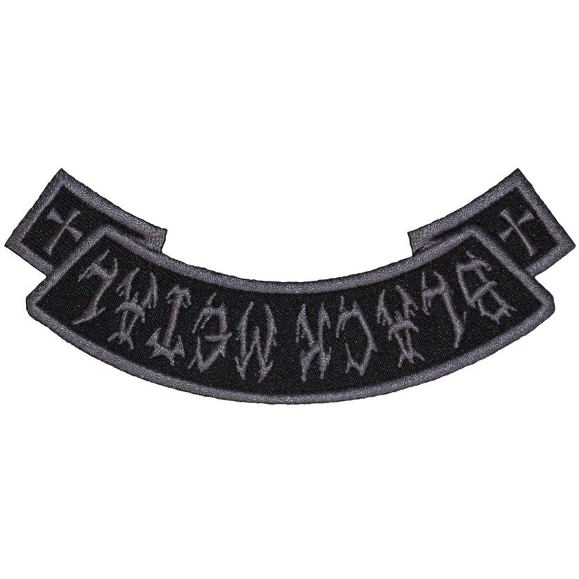 Black metal patch with text on a white background