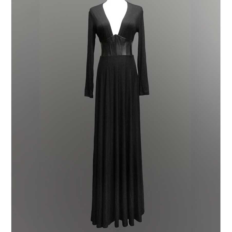 Black evening gown with sheer panels on a gray background