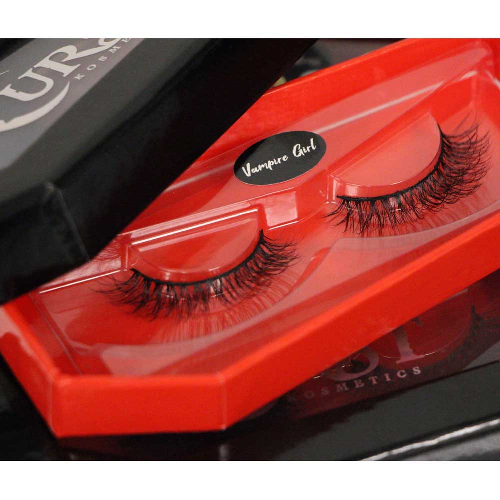 Red false eyelash packaging with 'Vampire Girl' label on a black background