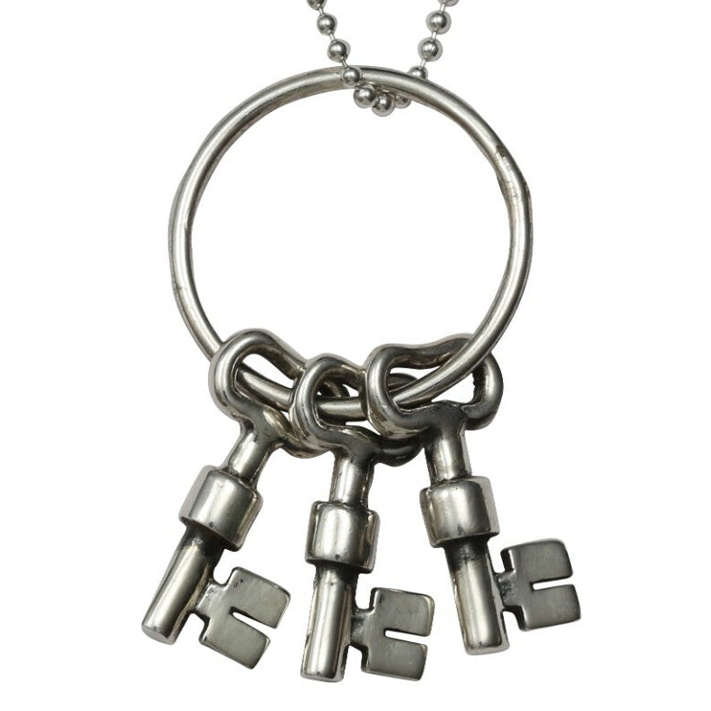 Necklace with key-shaped pendants on a white background