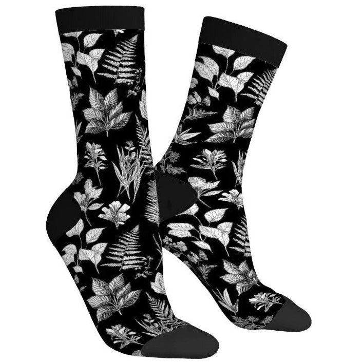 Black socks with white leaf pattern on a white background