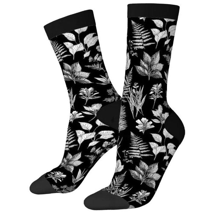 Black socks with white leaf pattern on a white background