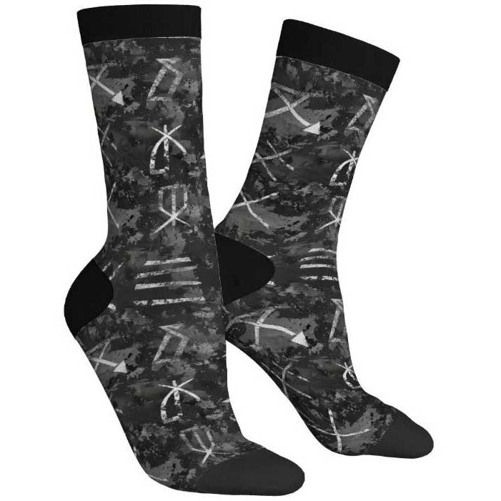 Black socks with white geometric pattern on a white background