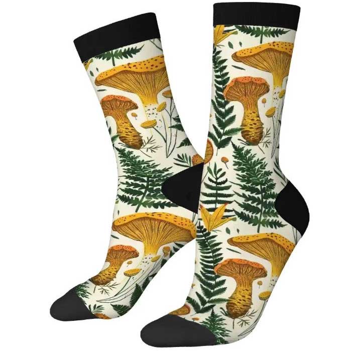 Pair of socks with mushroom and fern pattern on a white background