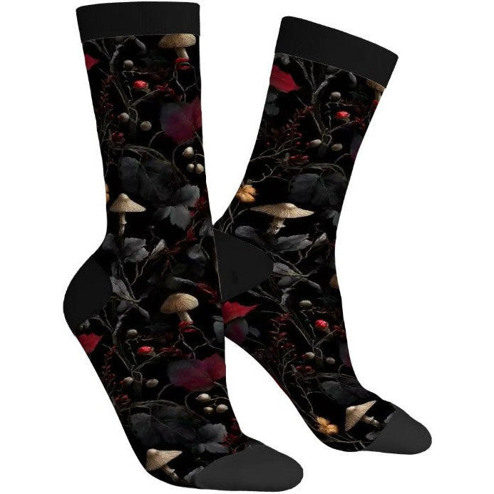 Pair of socks with a dark forest design featuring mushrooms and leaves on a white background