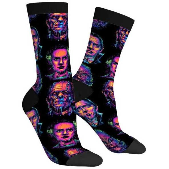 Pair of socks with a colorful pattern of faces on a white background